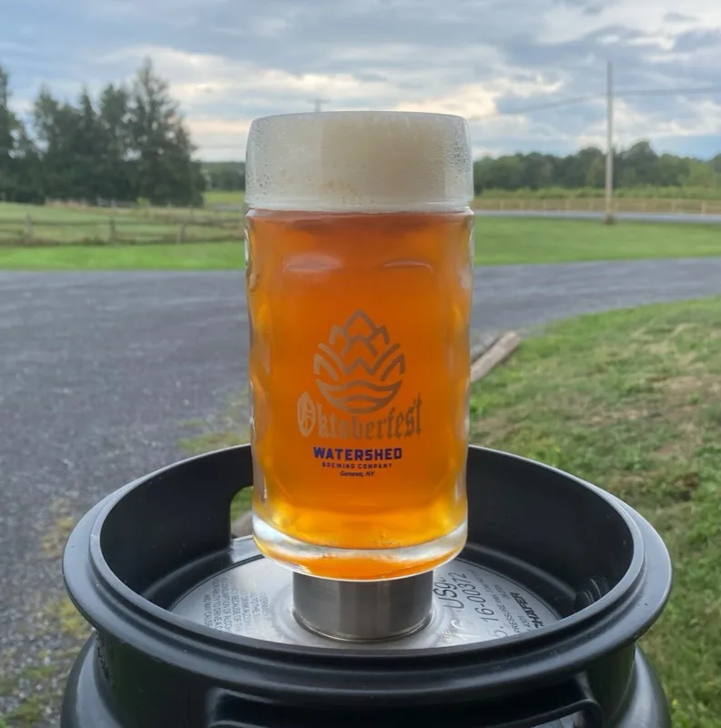 Watershed Oktoberfest stein on a keg with scenic backdrop